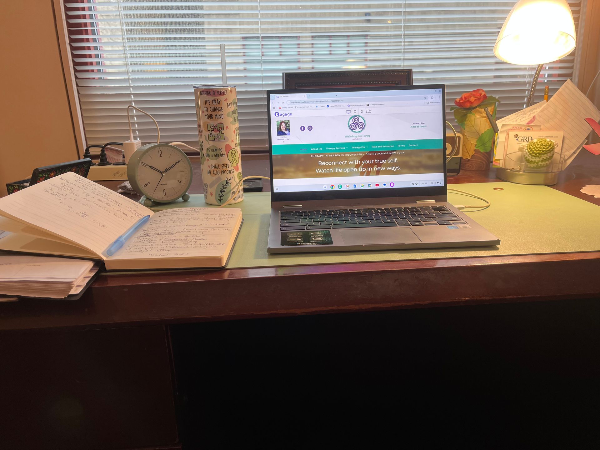 work station with laptop and notebook
