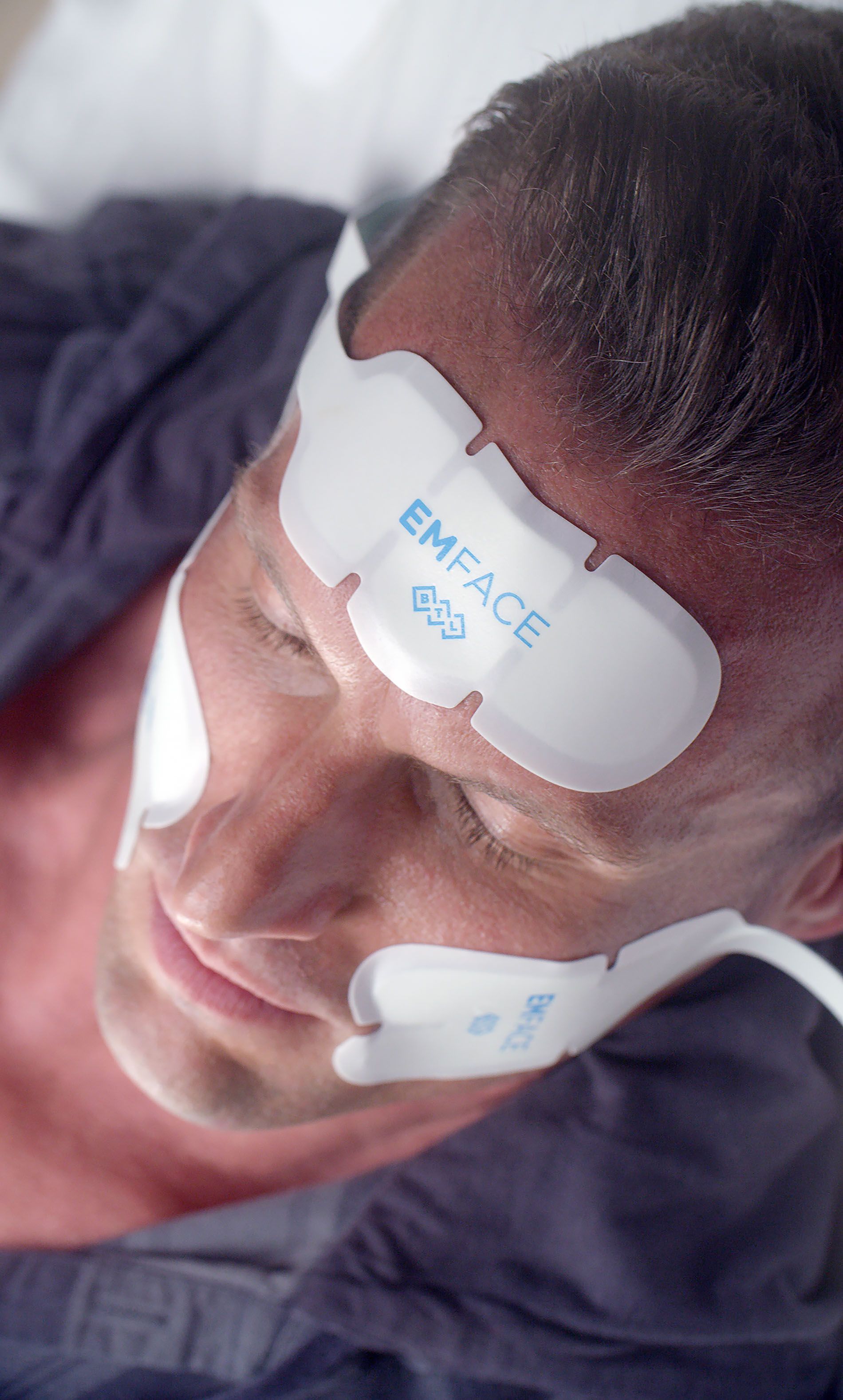 Male patient receiving EMFACE treatment
