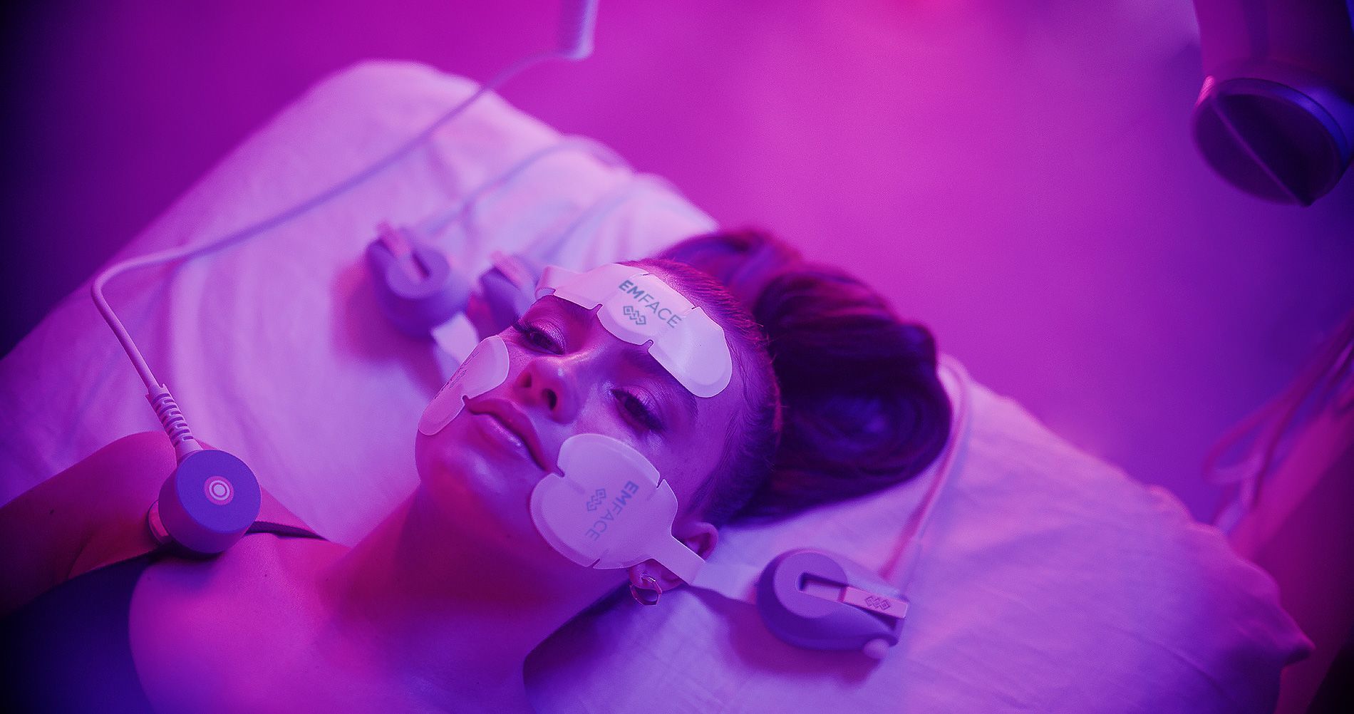 Patient using EMFACE treatment