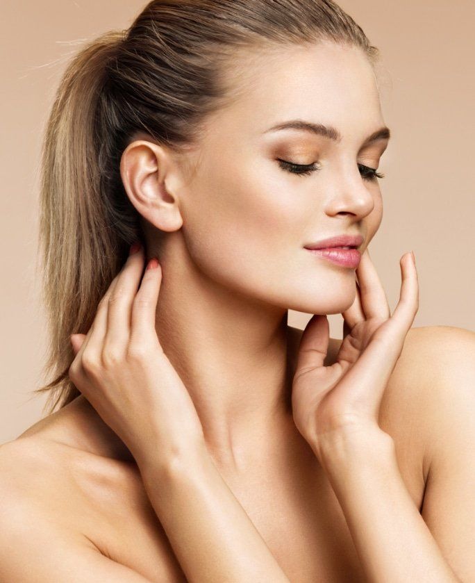 Dermatology professional examining a patient's skin