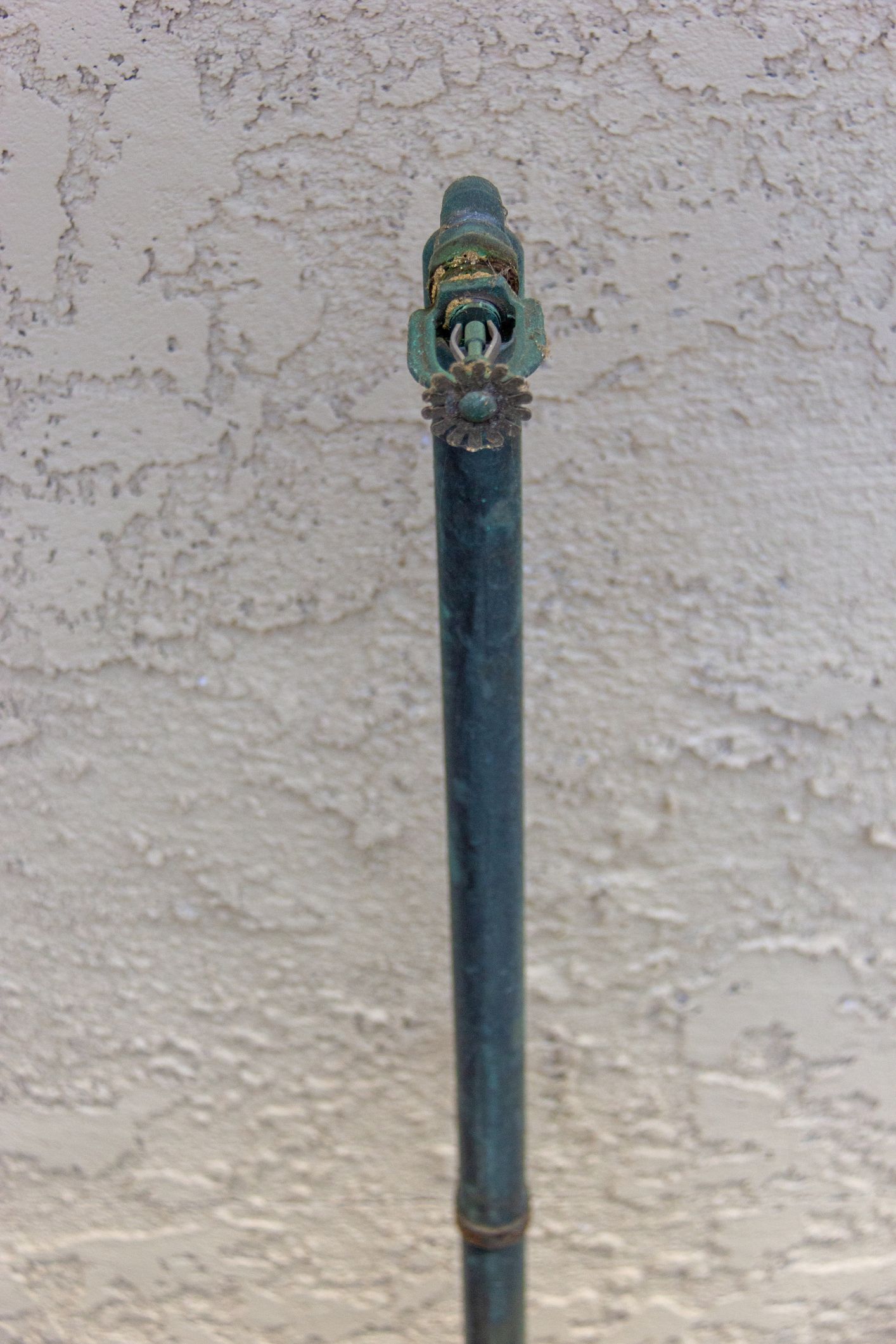 A Close up of a Water pipe Against a White Wall - Fire Sprinkler Services in Fort Wayne, IN A Close up of a Water pipe Against a White Wall - Fire Sprinkler Services in Fort Wayne, IN
