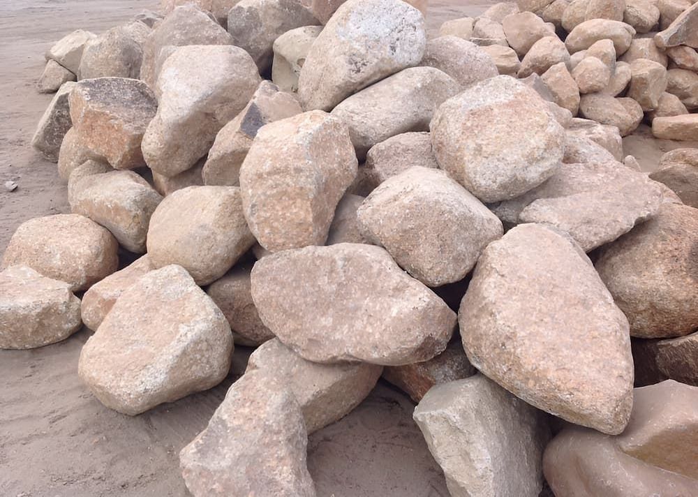 A Pile Of Rocks Sitting On Top Of Each Other On The Ground — Scott Kennedy's Landscape & Garden Supplies In Shaw, QLD