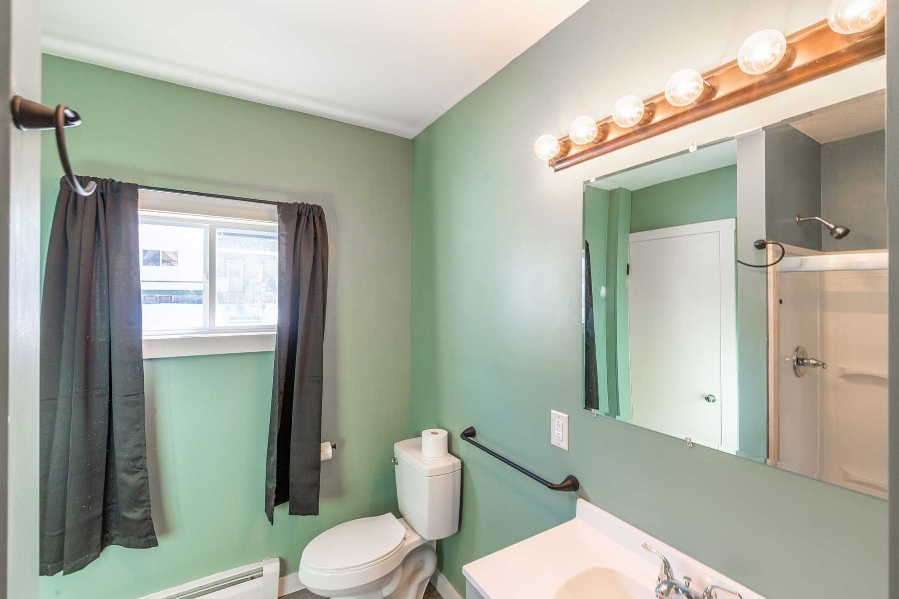Updated bathroom vanity in a Myrtle Street rental unit, Whitefield NH
