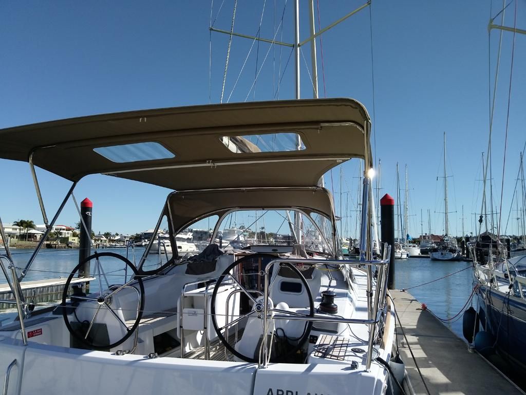 A Sailboat With a Shade Sail is Docked at a Marina — The Boat Cover Company In Buddina, QLD
