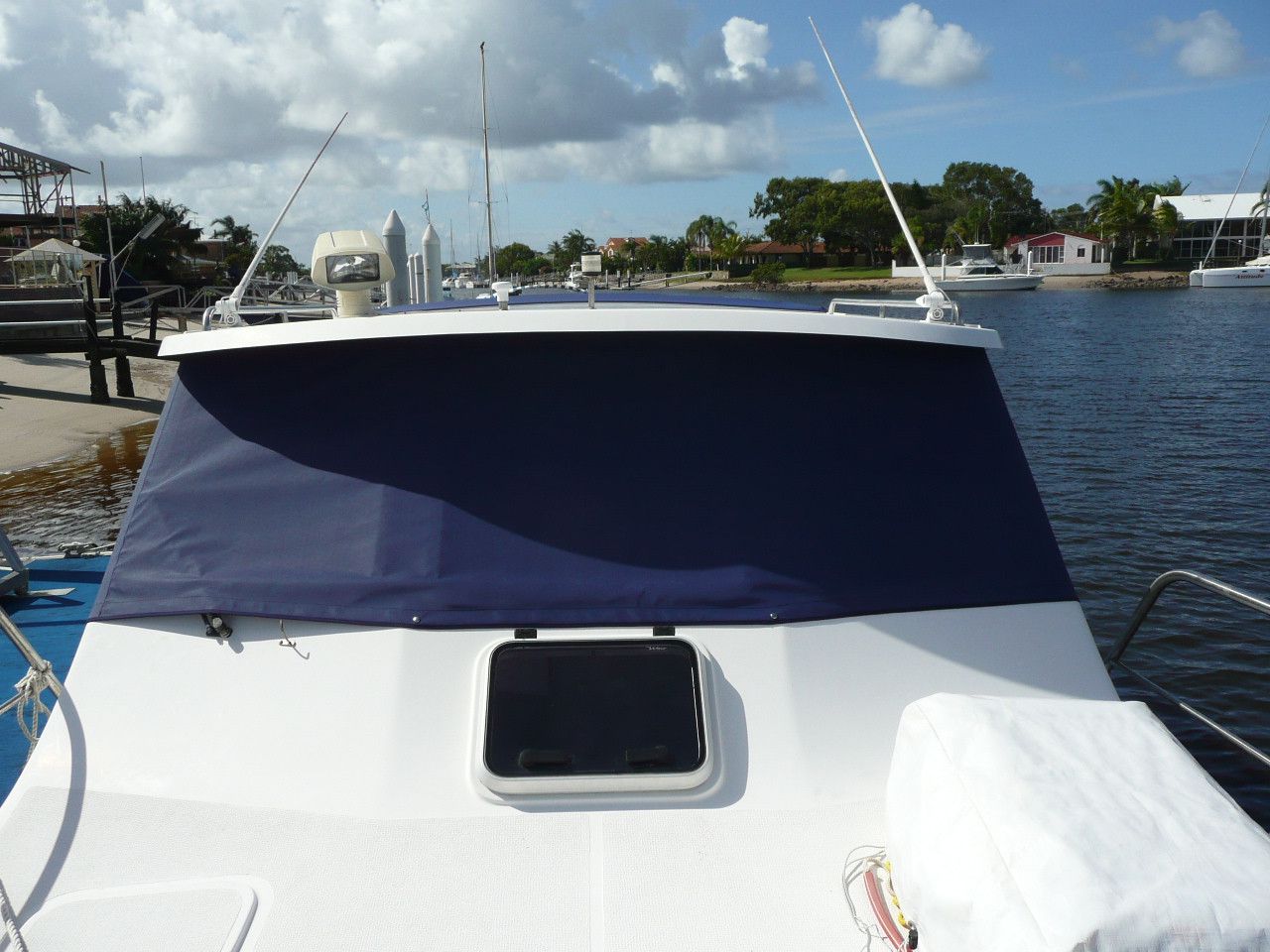 The Front of a Boat With a Blue Cover on It — The Boat Cover Company In Buddina, QLD
