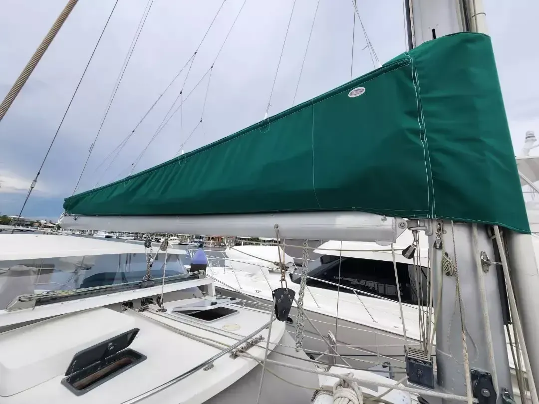 Green Sail Cover on a Sailboat Boom — The Boat Cover Company In Buddina, QLD