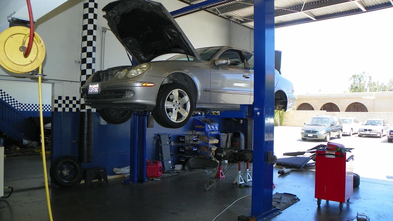 Vehicle Service Bay With Car On Lift | Zway Automotive