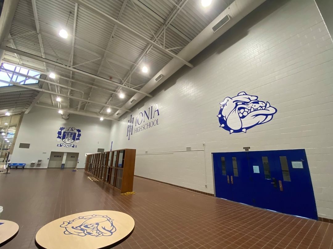 A large room with a mural of a dog on the wall.