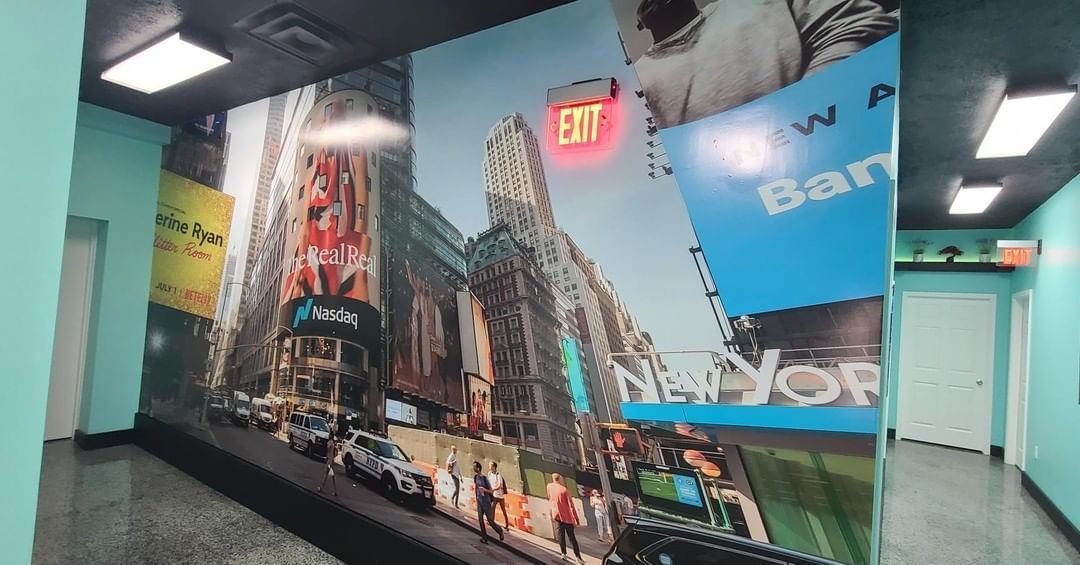 A wall with a picture of new york on it