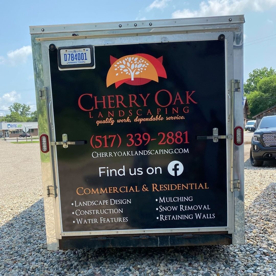 The back of a cherry oak landscaping trailer