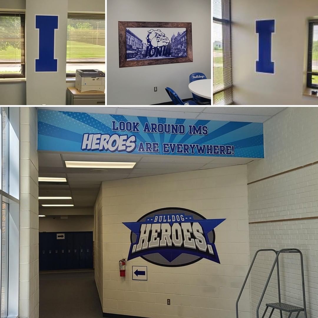 A hallway with a sign that says heroes on it