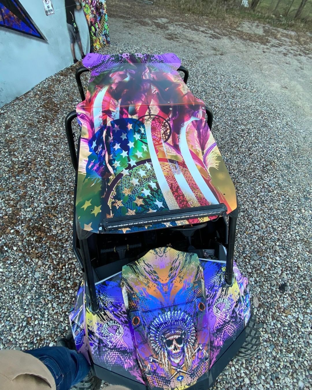 A colorful vehicle with an american flag painted on it