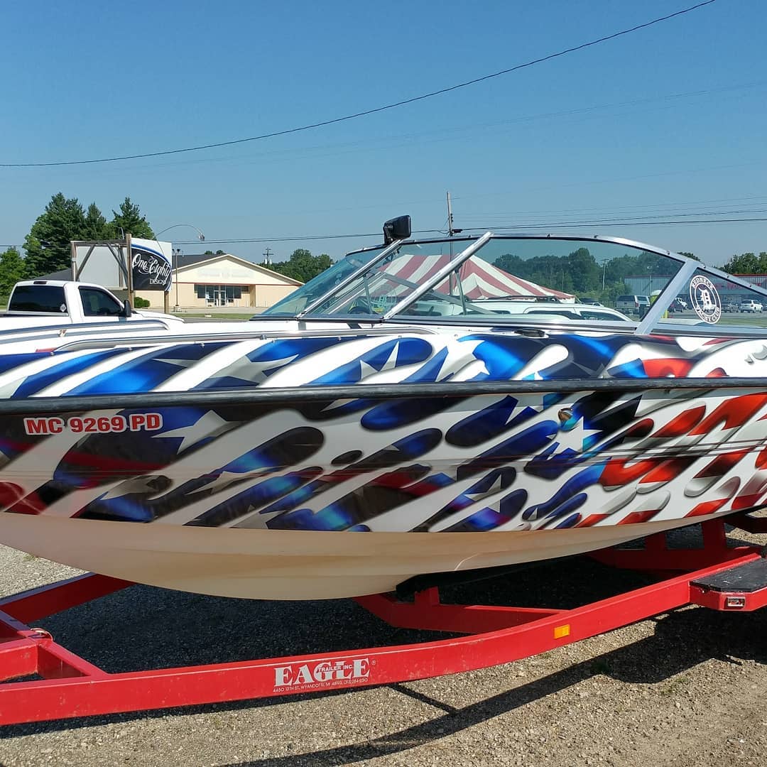 A boat on a trailer that says eagle on it