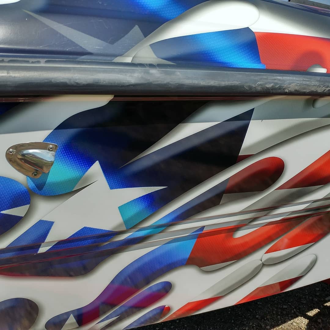 A red white and blue design on a vehicle