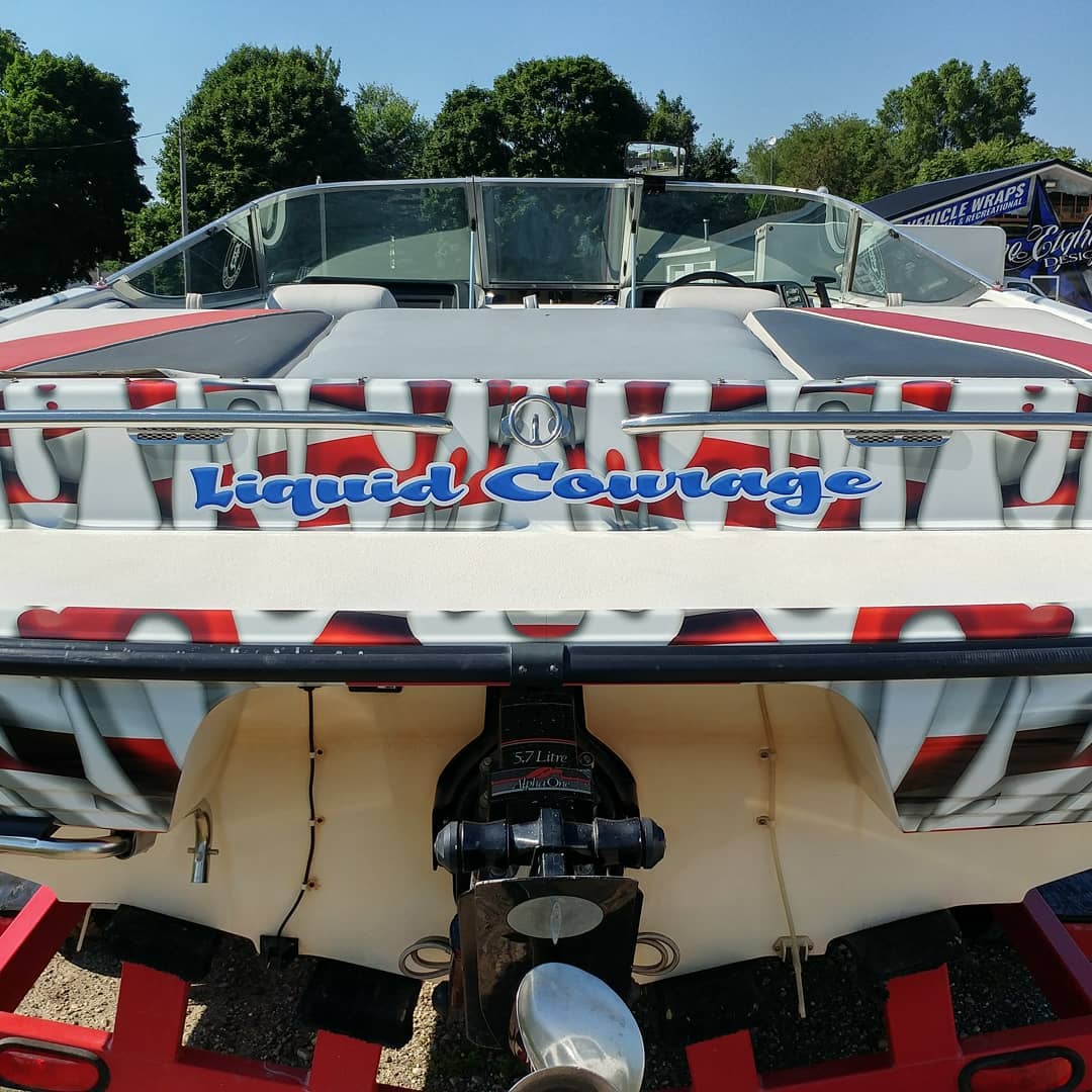 A boat that says liquid courage on it