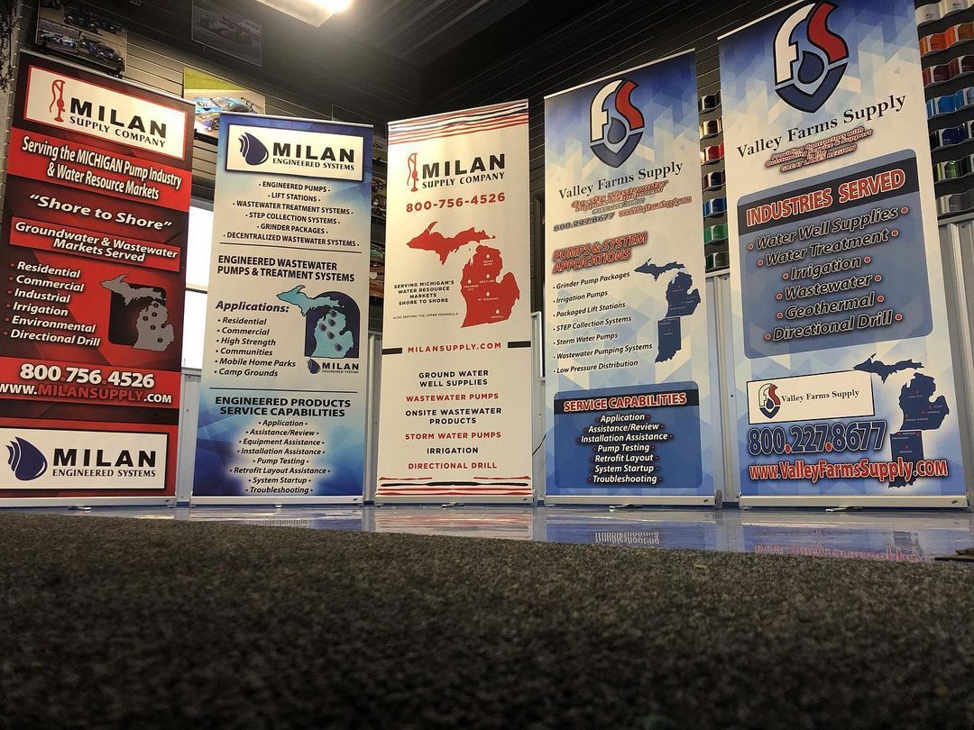 A row of signs with one that says milan on it