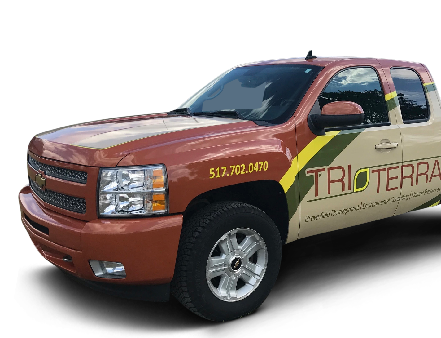 A brown truck with the word trioterra on the side