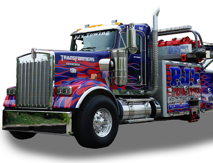A blue and red tow truck with transformers painted on it