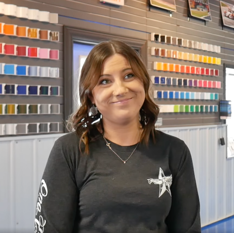 A woman wearing a black shirt with a star on it