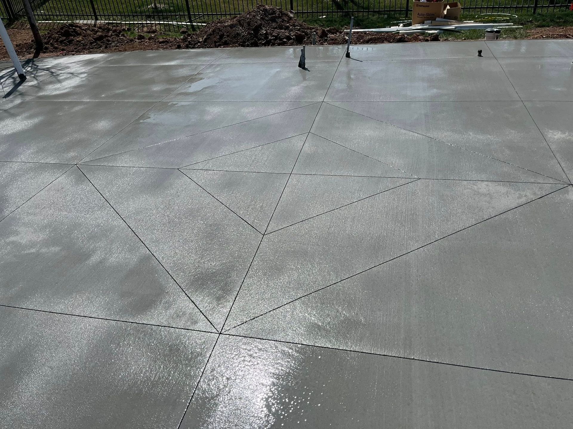 A concrete floor with a diamond pattern on it
