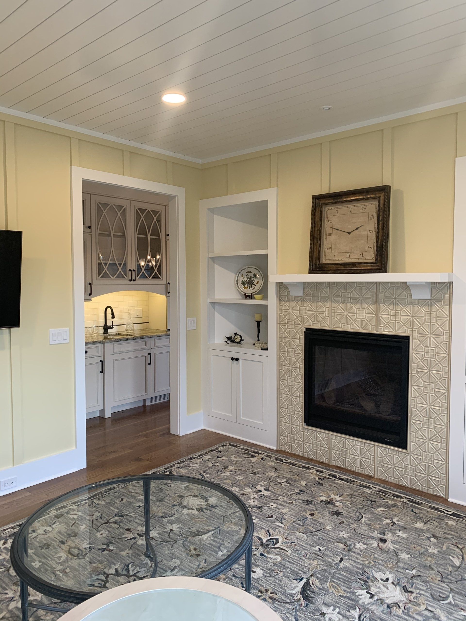 A kitchen with a stainless steel sink and a large island.