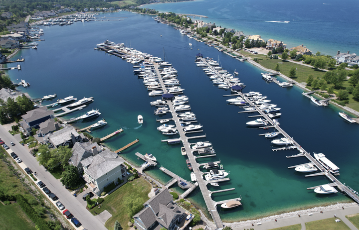 An aerial view of a marina with many boats docked
