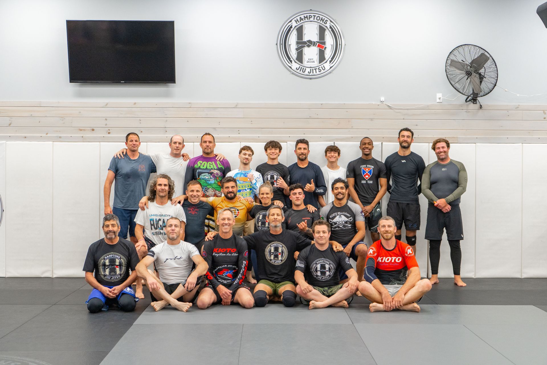 Adults practicing grappling drills at Hamptons Jiu-Jitsu in Southampton, NY, building fitness and calm focus.