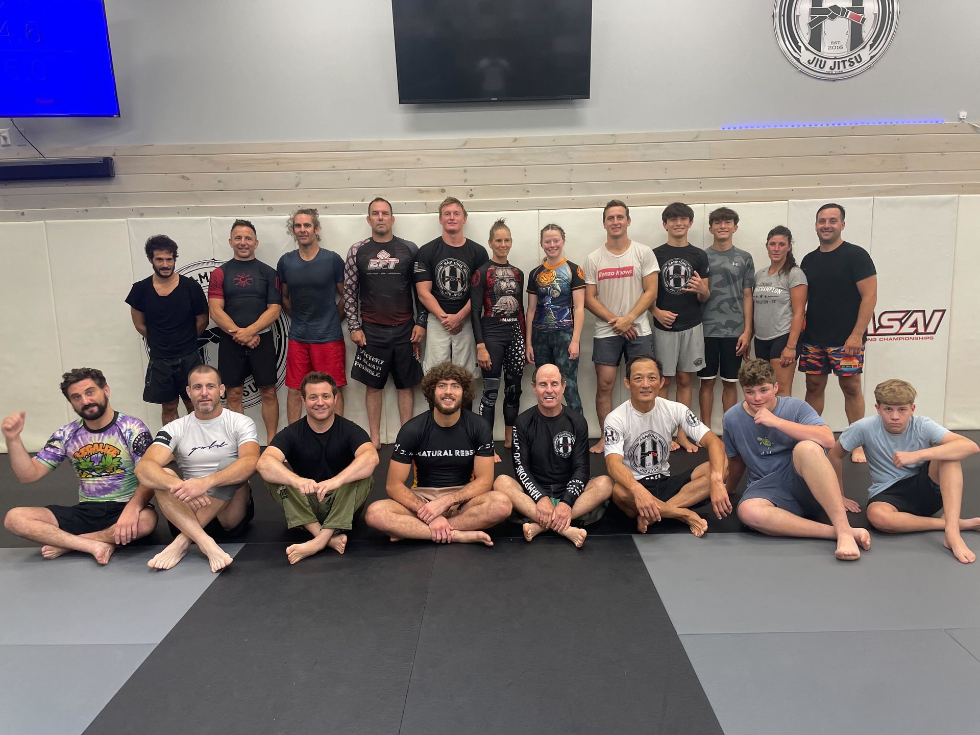 Adults practicing Brazilian Jiu-Jitsu drills at Hamptons Jiu-Jitsu in Southampton, NY for fitness and stress relief.