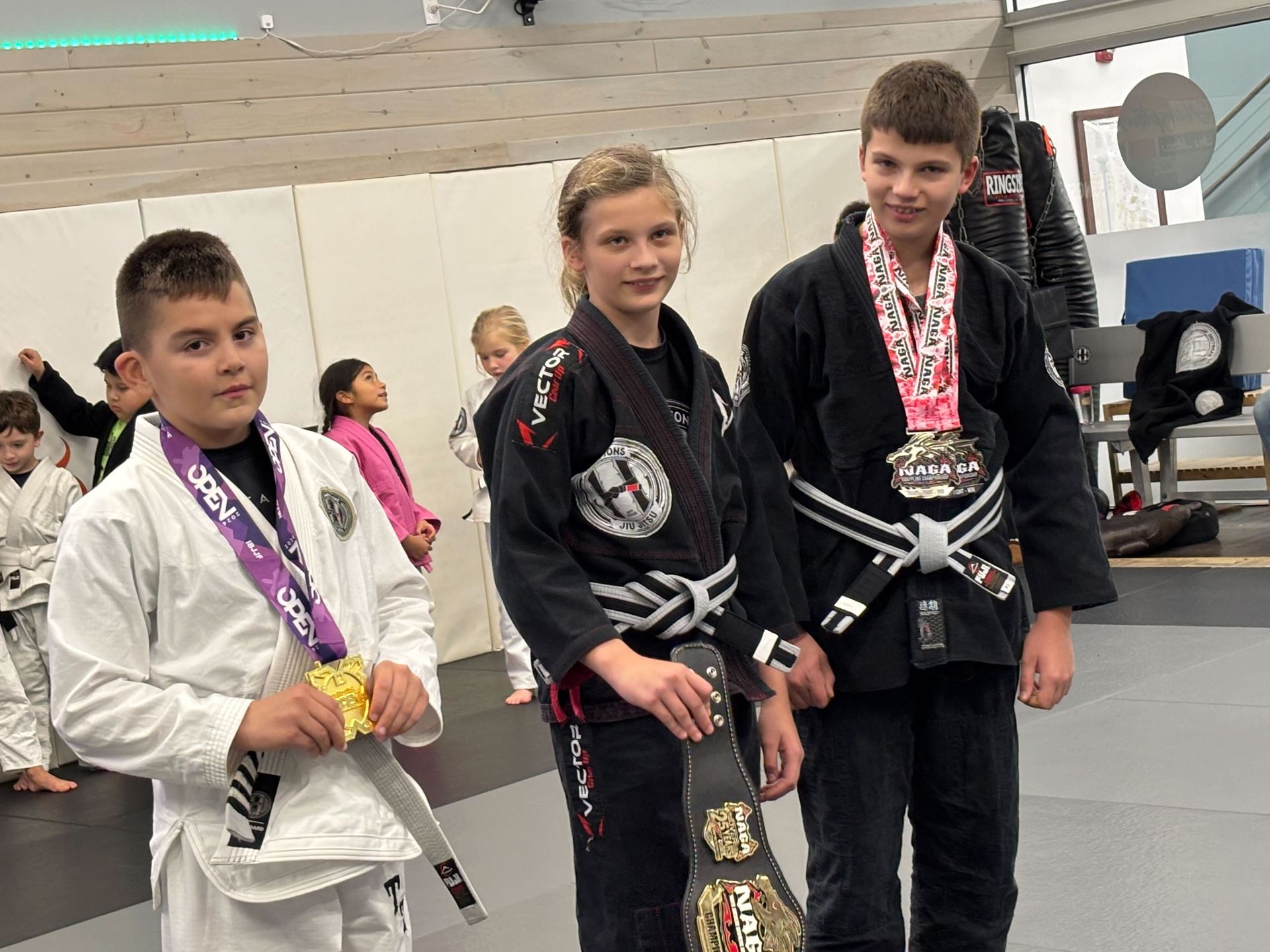 Kids practicing controlled grappling in a youth class at Hamptons Jiu-Jitsu in Southampton, NY, building confidence.