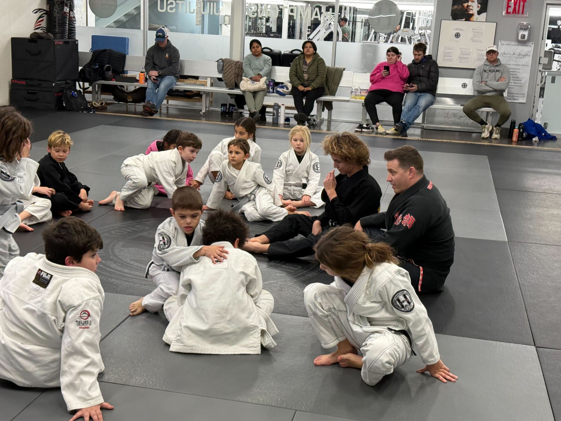 Partners practice brazilian jiu jitsu techniques at Hamptons Jiu-Jitsu in Southampton, NY for fitness and focus