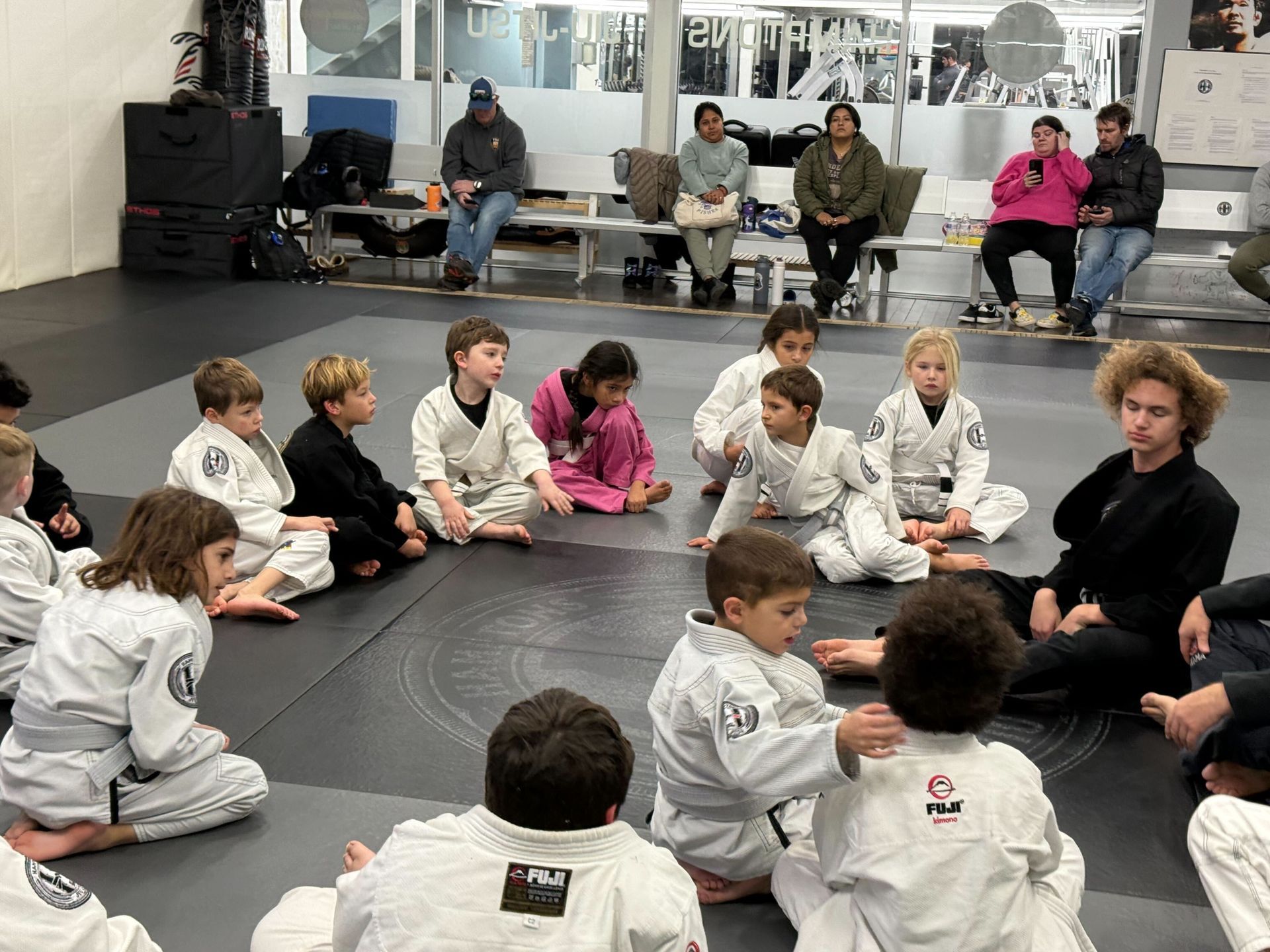Adults practicing jiu jitsu drills at Hamptons Jiu-Jitsu in Southampton, NY, building calm confidence and fitness.