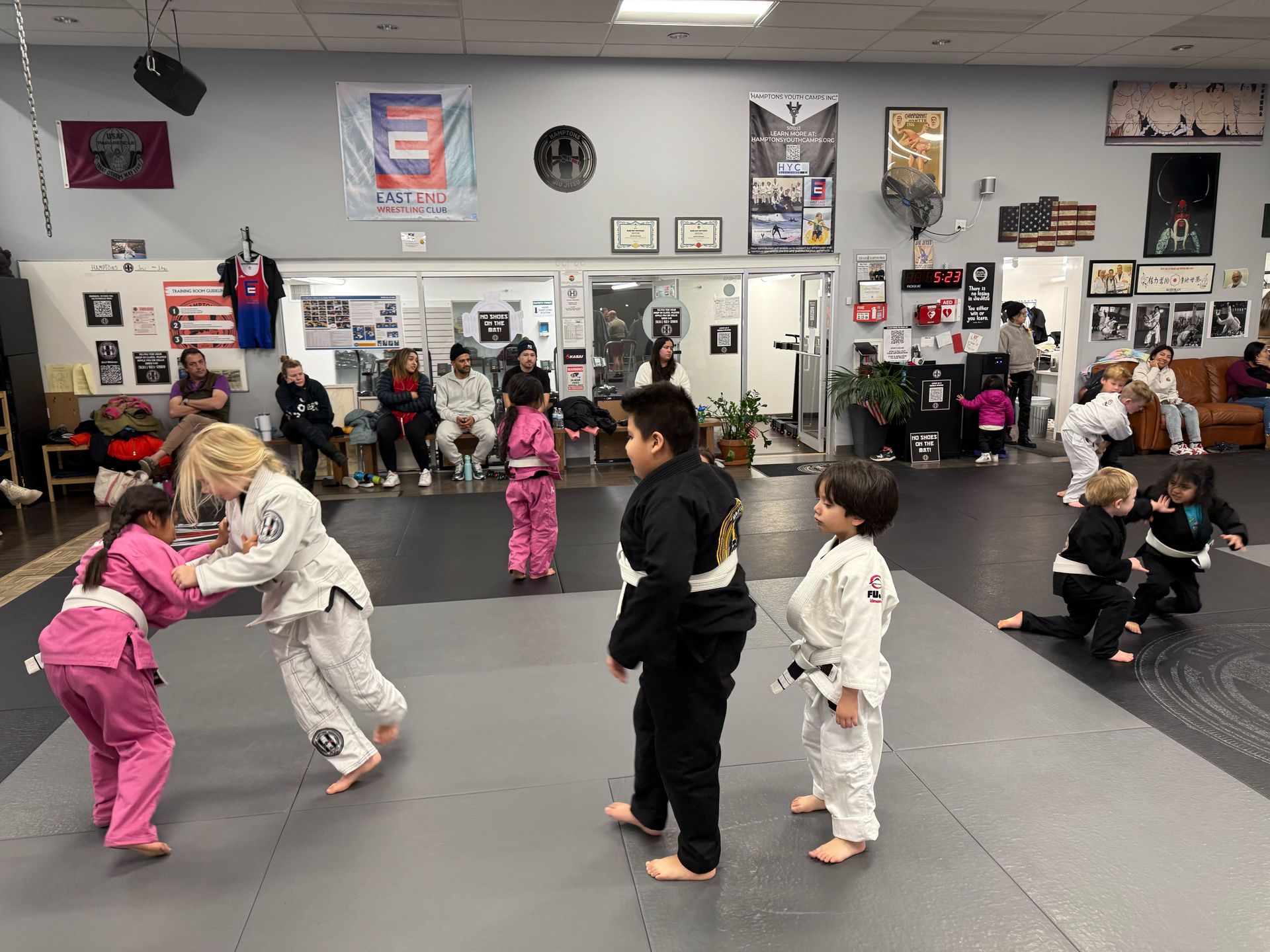 Kids practice controlled grappling in a Youth Jiu-Jitsu class at Hamptons Jiu-Jitsu in Southampton, NY, building confidence.