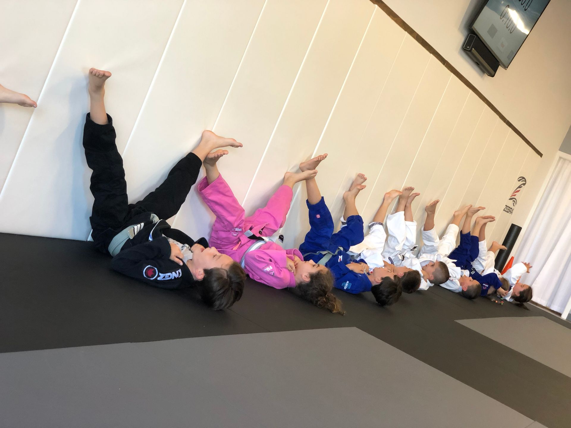Kids practice partner drills at Hamptons Jiu-Jitsu in Southampton, NY, building courage.