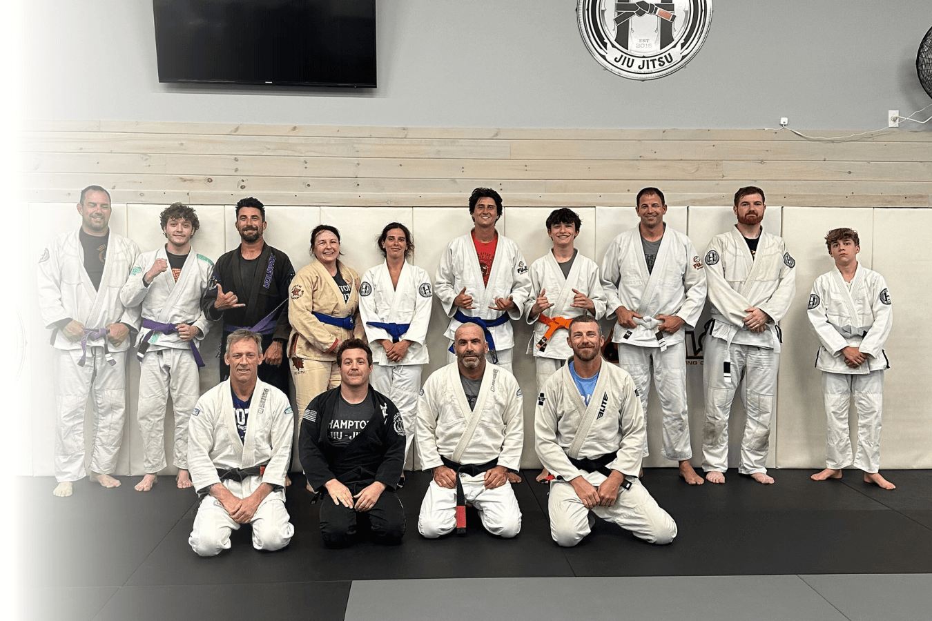 Adults practicing grappling drills at Hamptons Jiu-Jitsu in Southampton, NY to build resilience and calm focus.