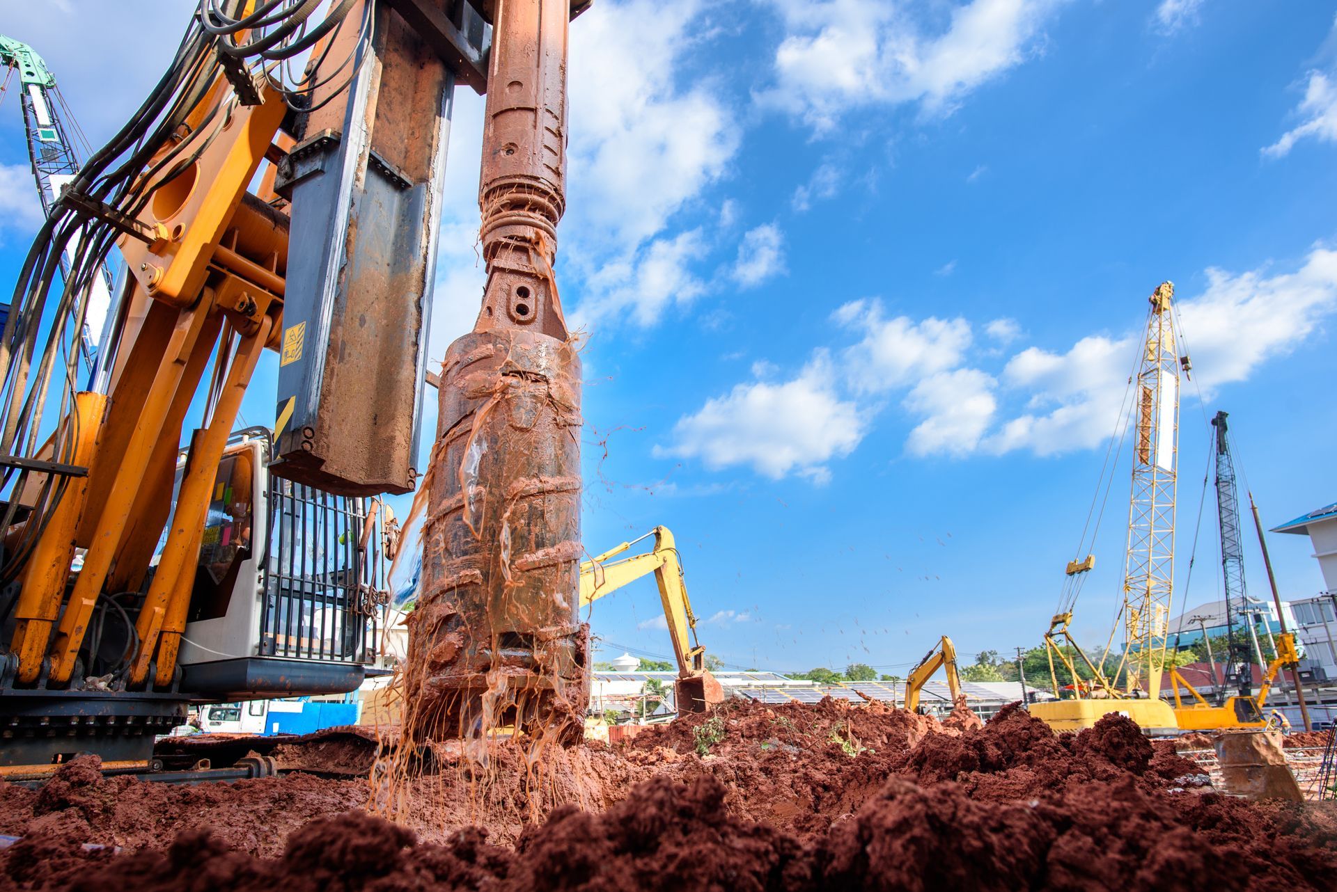 Commercial well drilling rig operating at a construction site