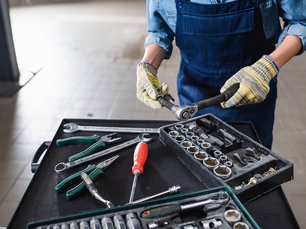 A professional working in a collision repair shop near Delhi, NY - Arkville, NY | Erickson's Automotive Inc Auto collision repair service in progress near Woodstock, NY