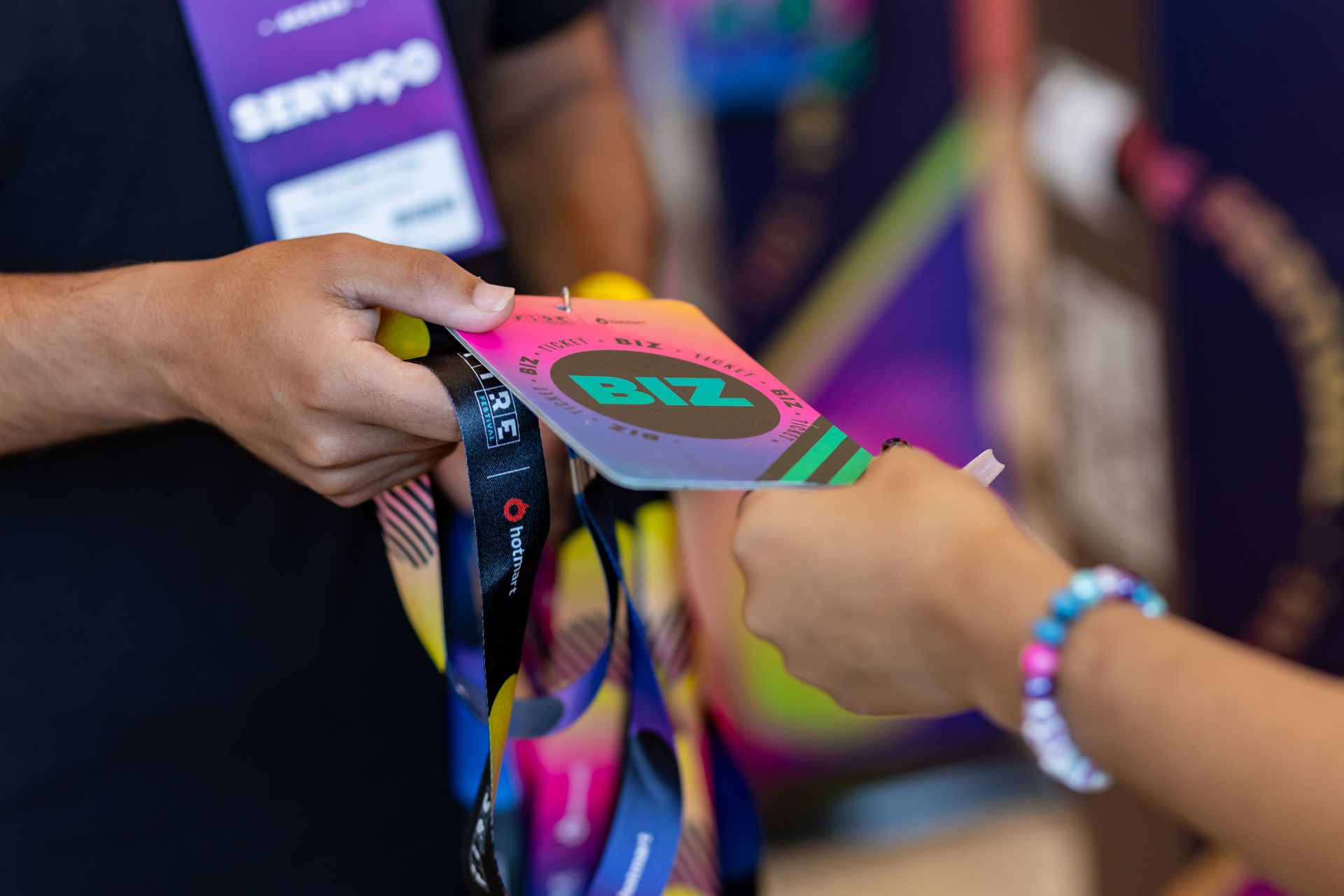 A man is handing a badge to a woman.