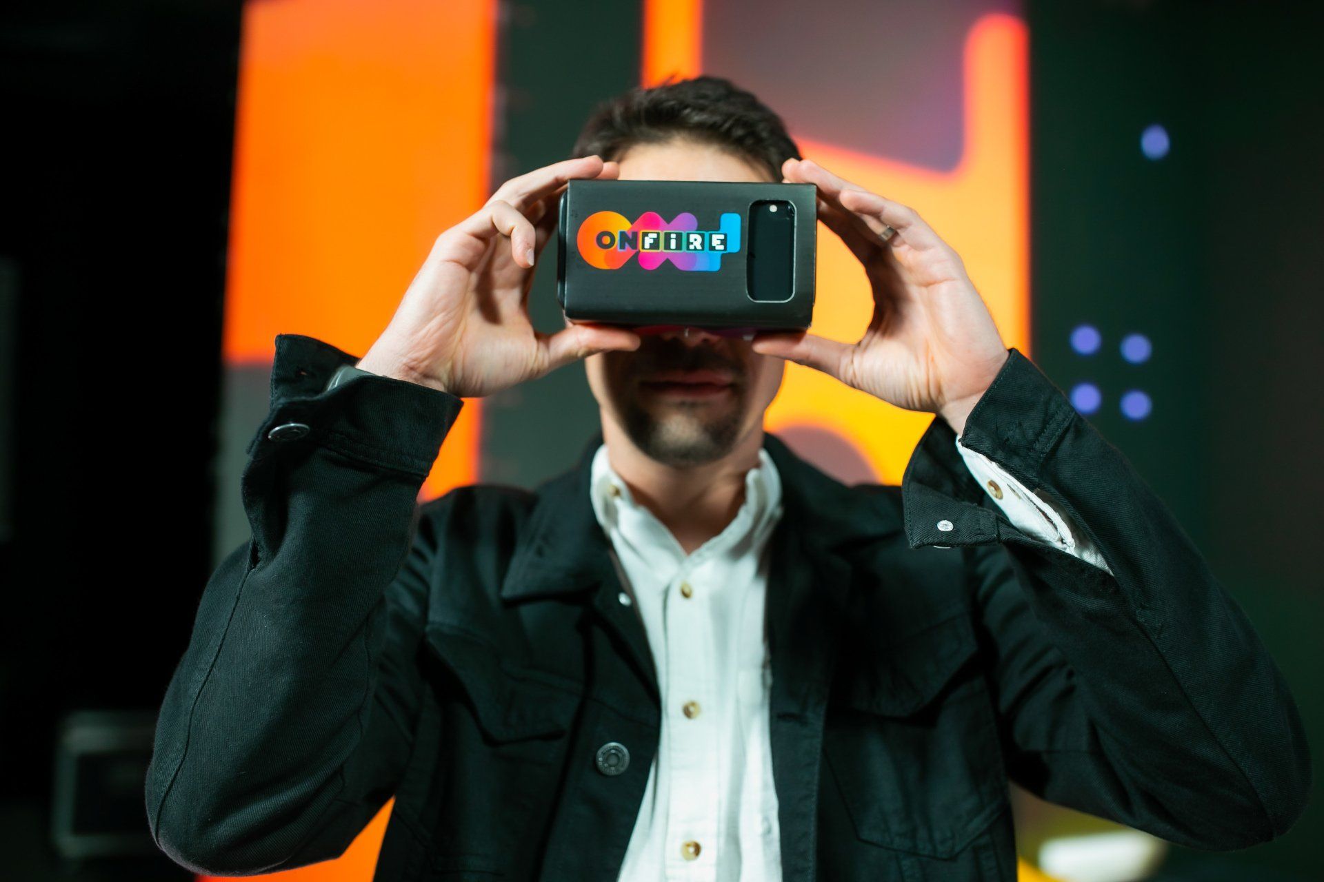 A man is wearing a virtual reality headset.