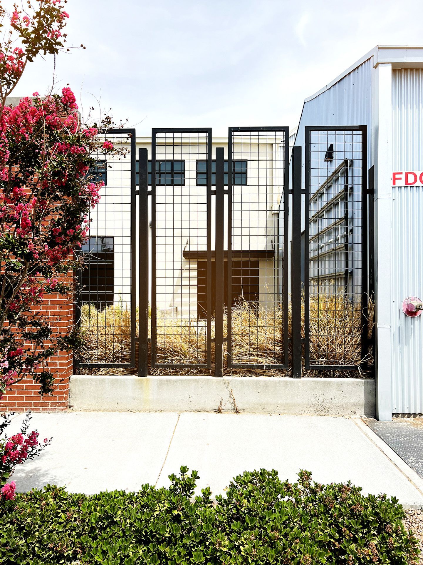 A white building with a sign that says eds on it