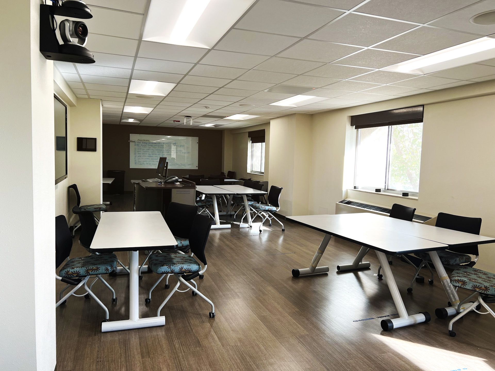 A large room with tables and chairs in it