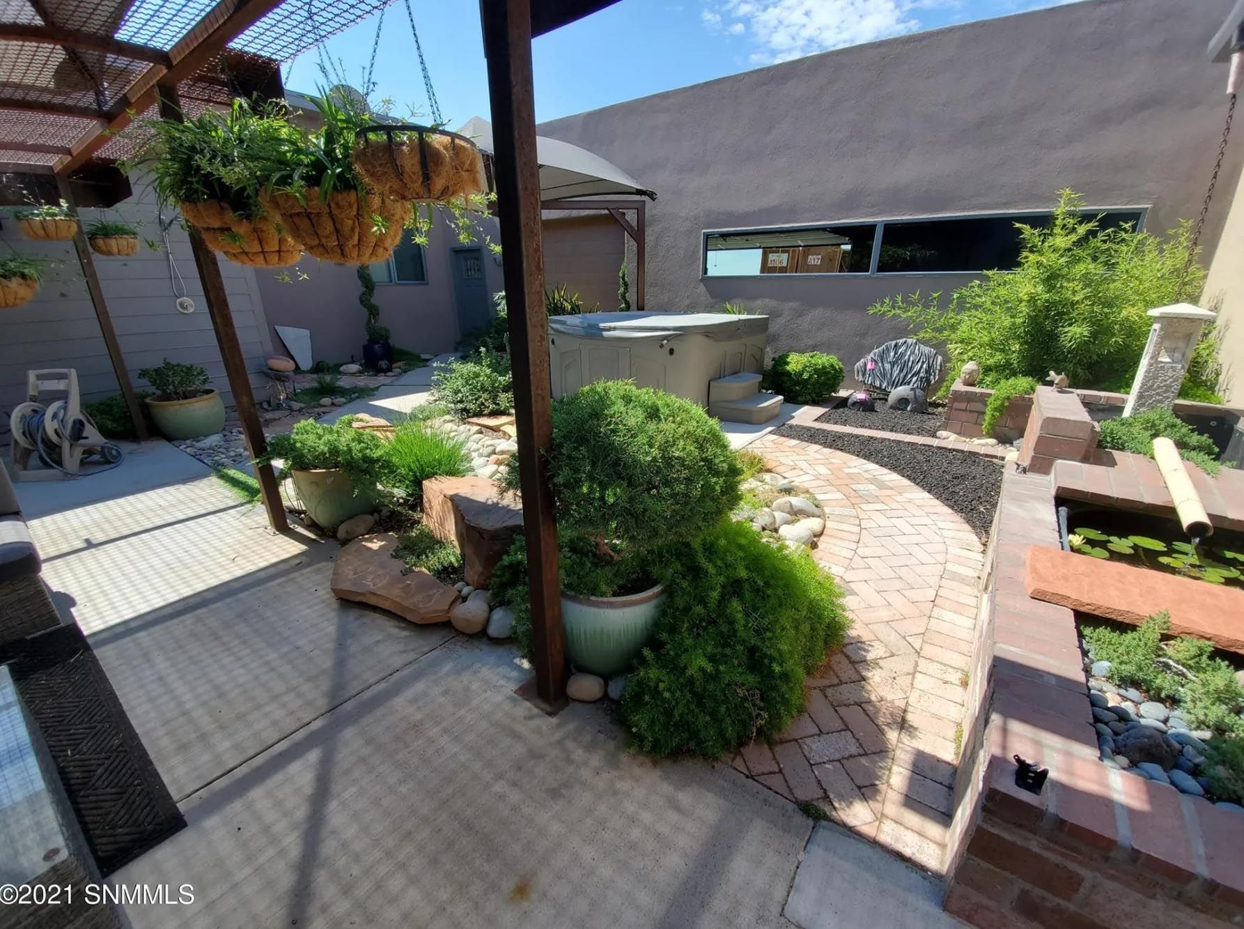 There is a hot tub in the middle of the garden.