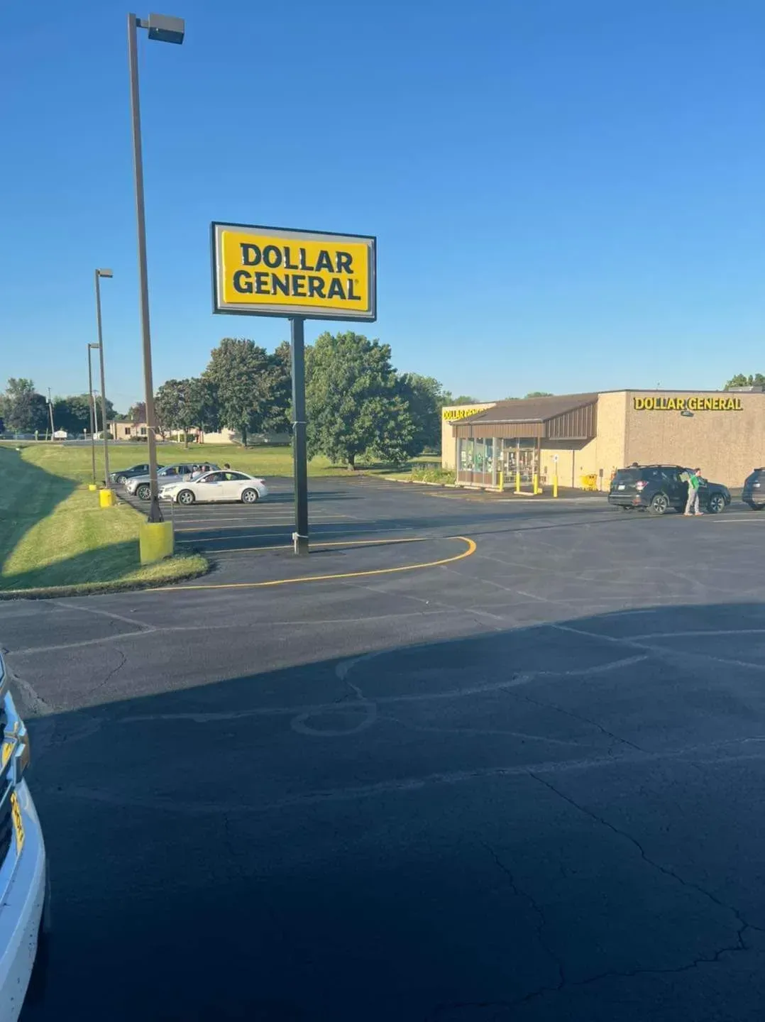A dollar general store is located in a parking lot