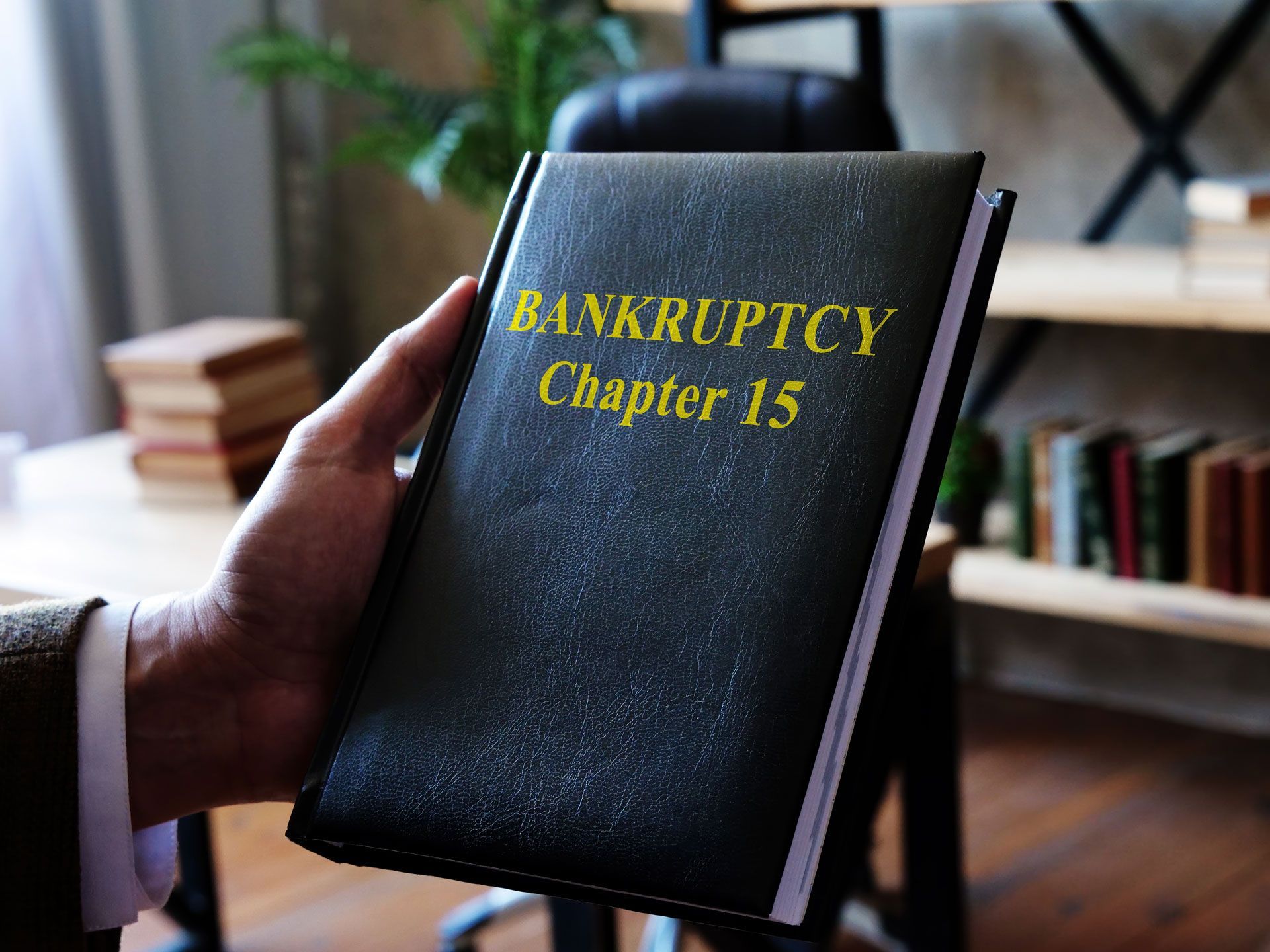 Holding a black bankruptcy law book
