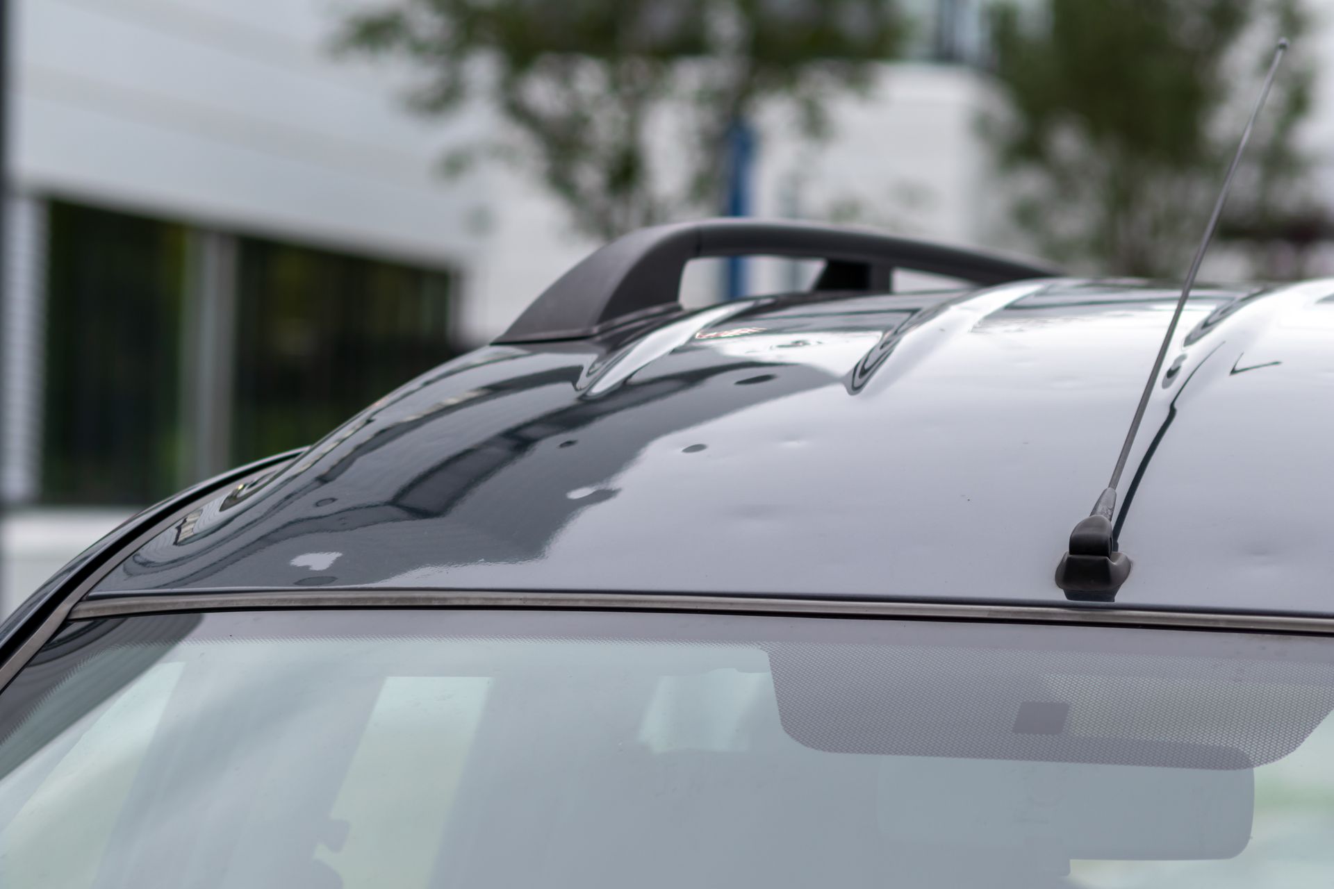 Vehicle's roof showing subtle damage from small hail impacts. Vehicle's roof showing subtle damage from small hail impacts.