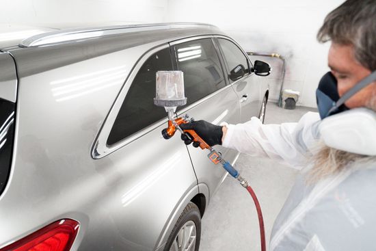 A professional doing a repair after one of the collisions in Oklahoma City, OK