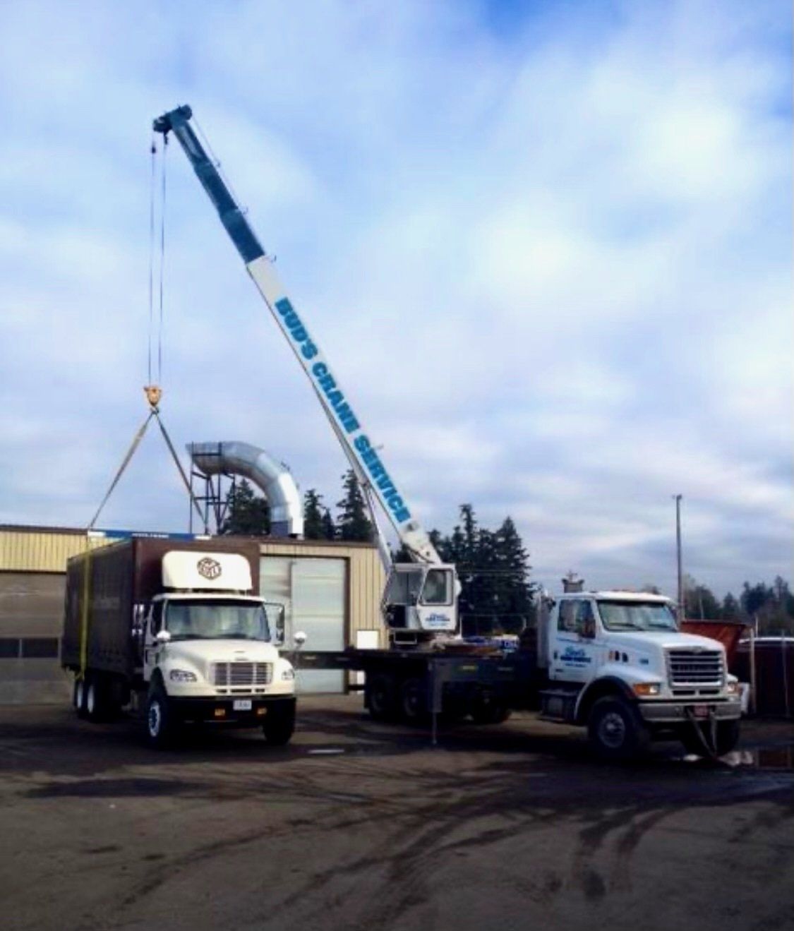 A crane lifting a truck — Oregon City, OR  — Bud's Crane Service Inc