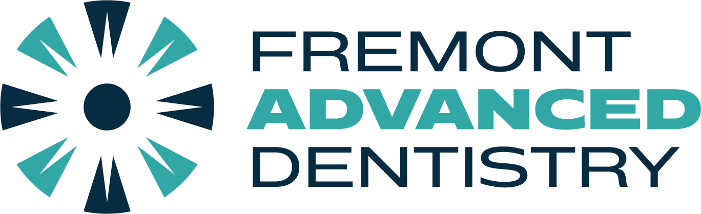 Logo of Fremont Advanced Dentistry. Features teal and navy circular design with the name in black and teal.