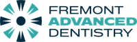 Logo of Fremont Advanced Dentistry. Features teal and navy circular design with the name in black and teal.