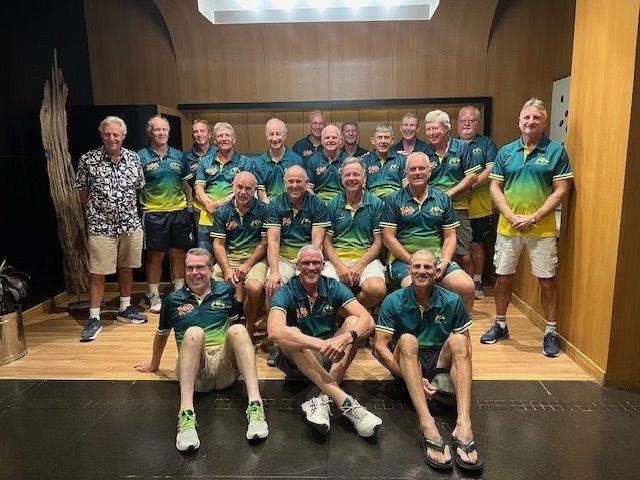 Group of men in Australia team shirts posing for a photo