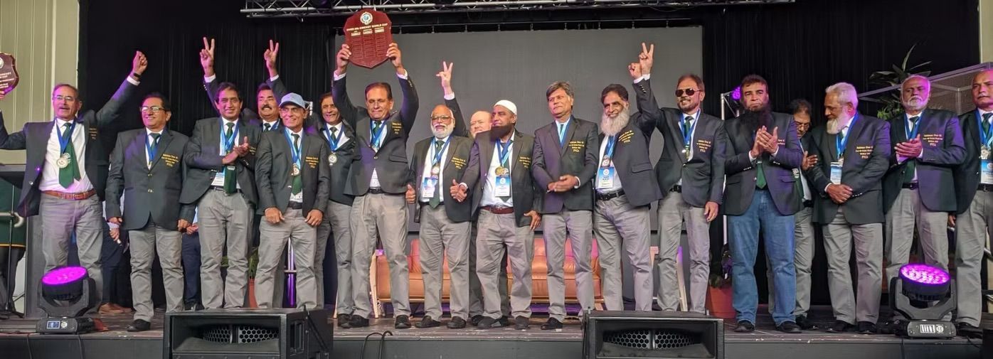 World Cup 2023 A group of men in suits on a stage holding a trophy, celebrating